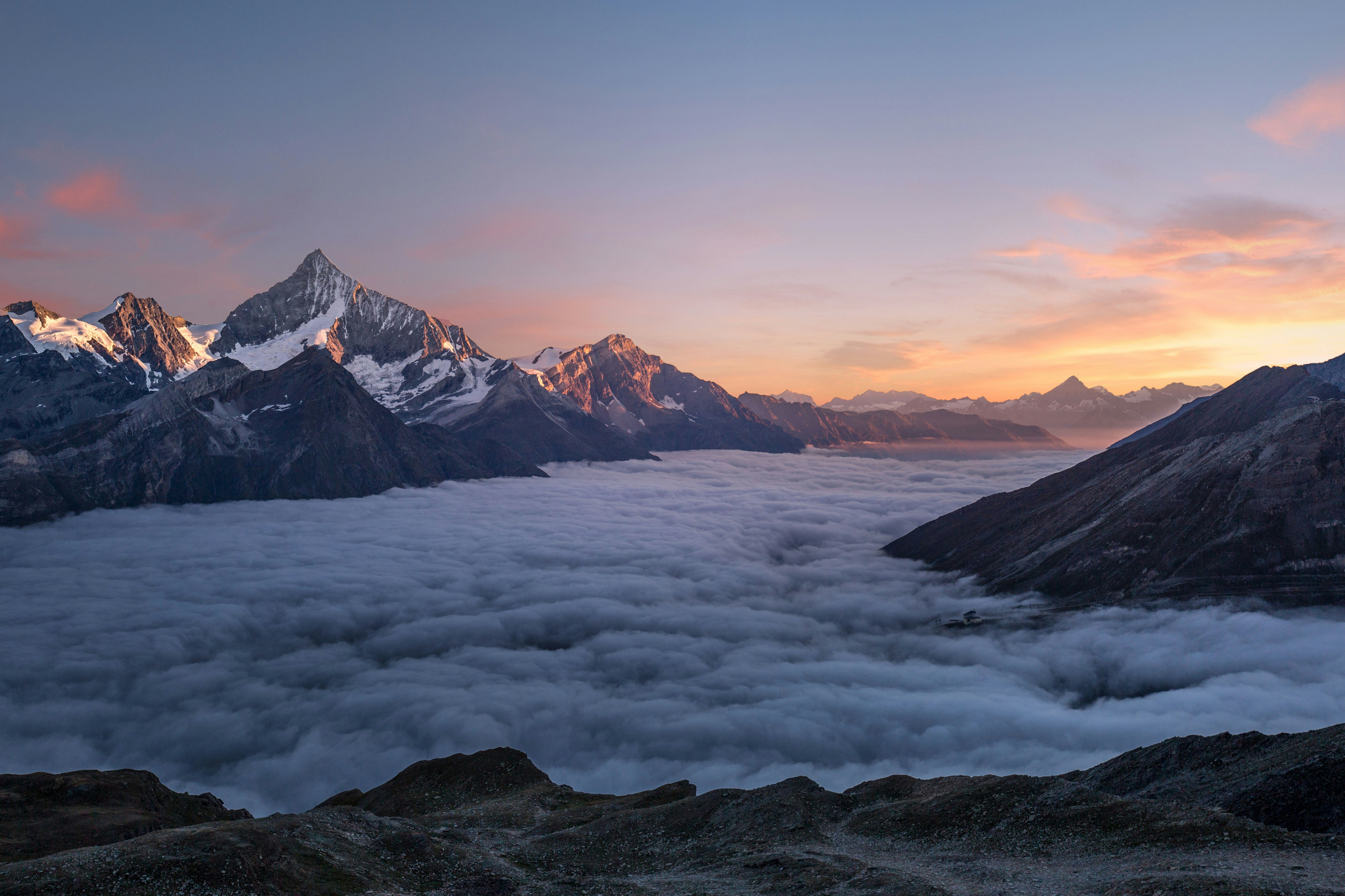 Athlete performing a high-intensity interval training workout in a scenic mountainous, high-altitude environment.