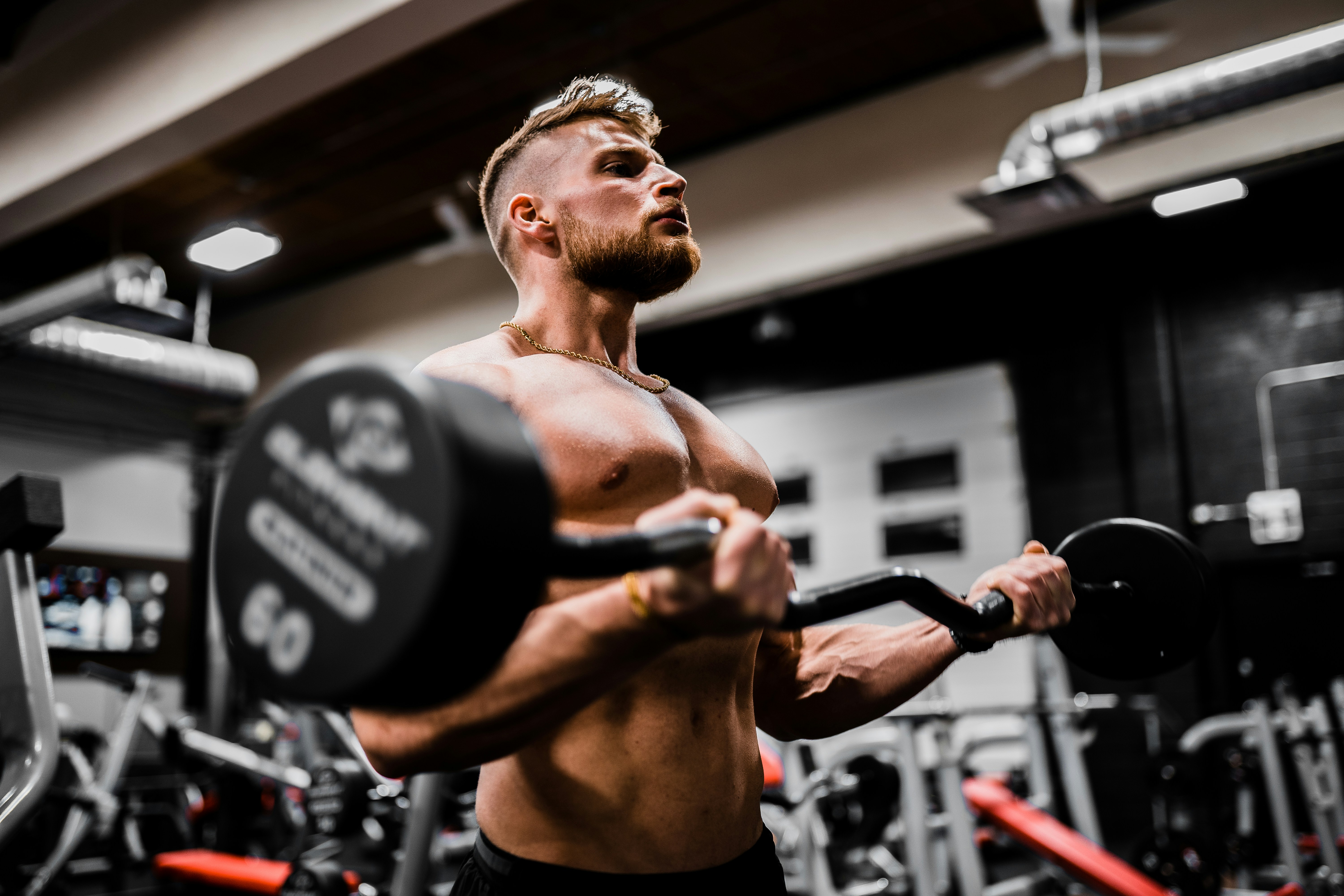 Person performing a dumbbell HIIT exercise with intensity