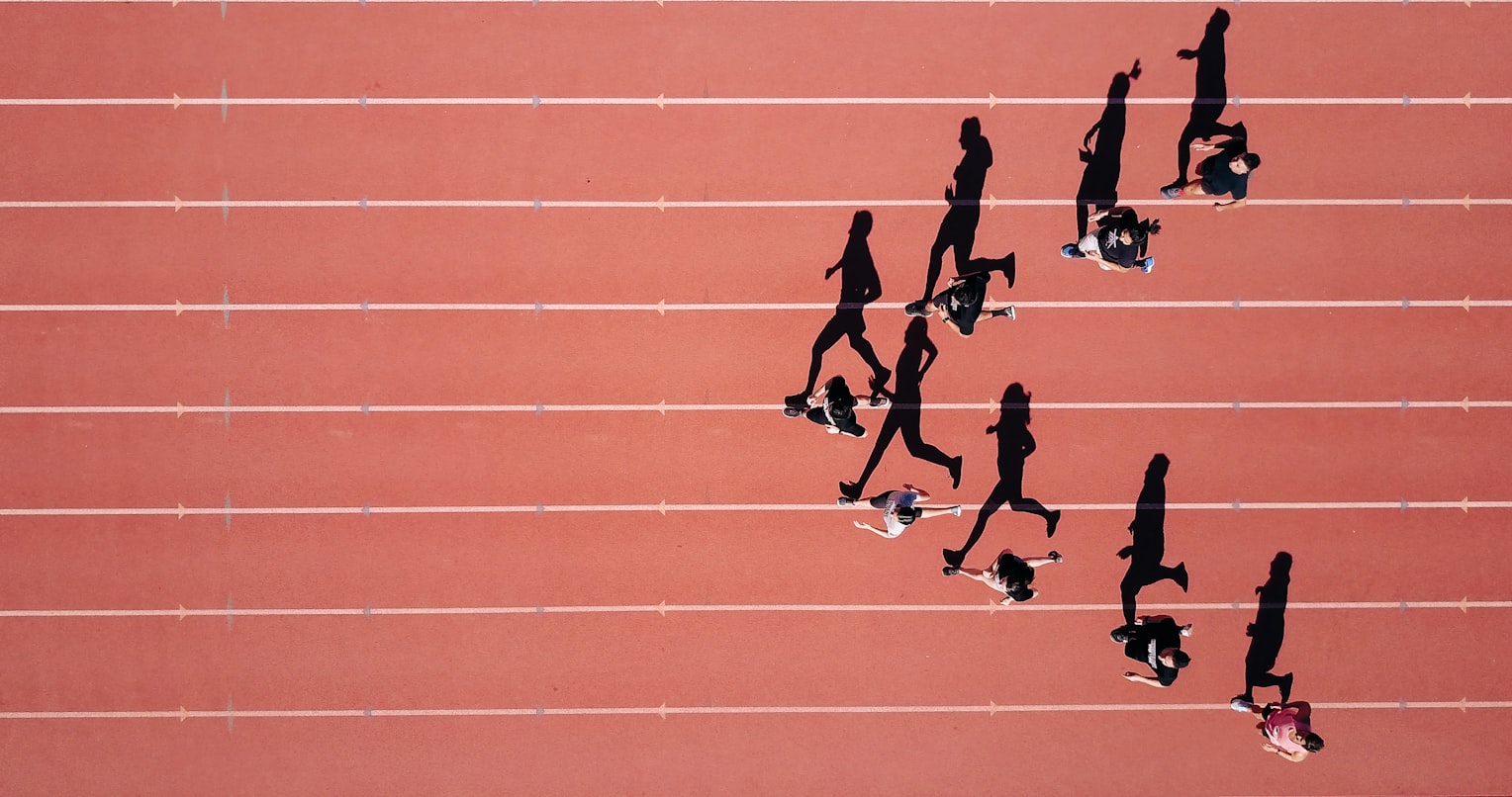 Runner incorporating sprint intervals into their endurance training on an outdoor track