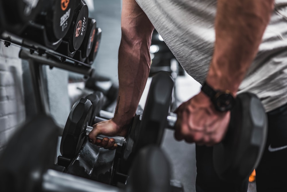 Person doing kettlebell swings during a HIIT strength workout