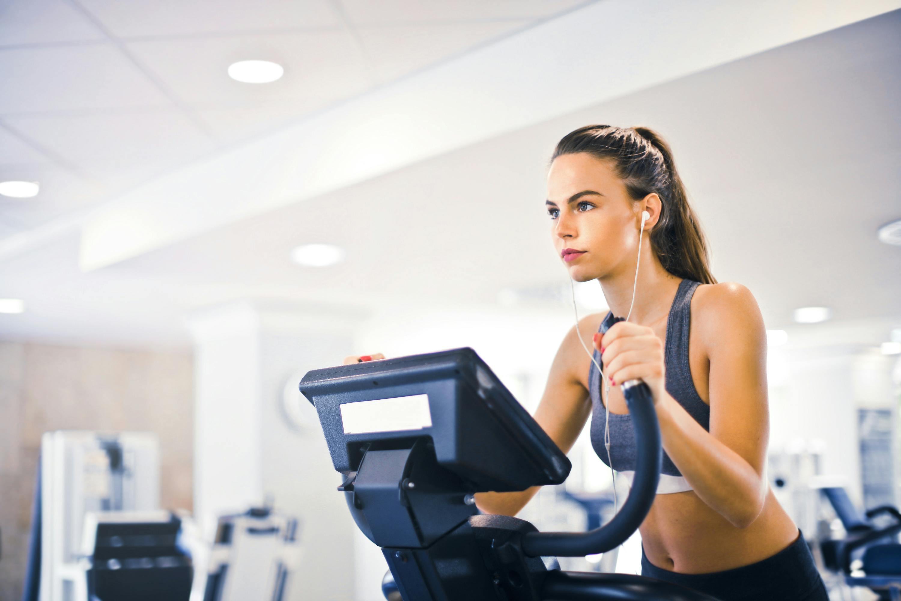 Person celebrating weight loss success with a healthy lifestyle